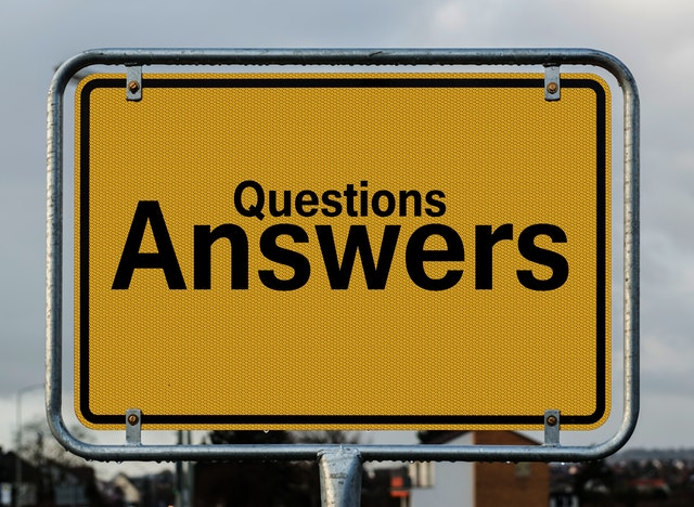 A sign saying Questions Answers