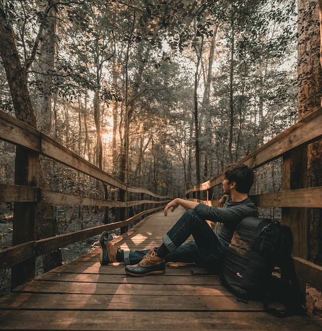 A person taking a break in the woods