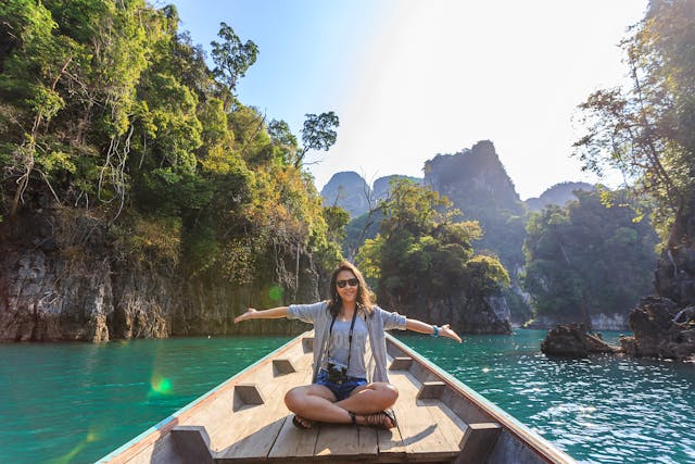 A picture of a person on a boat in a exotic place